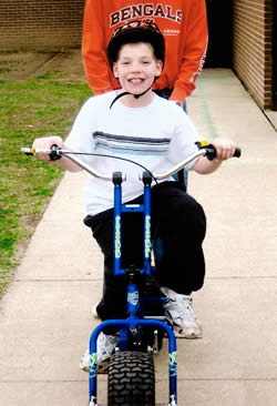 Variety Kid Mason on his new bike